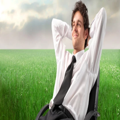 man in chair a field stock image