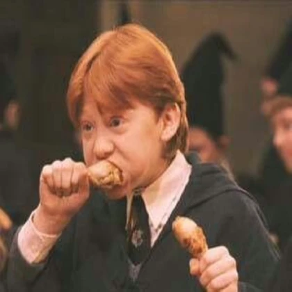 Ron Weasley eating a Chicken Wing